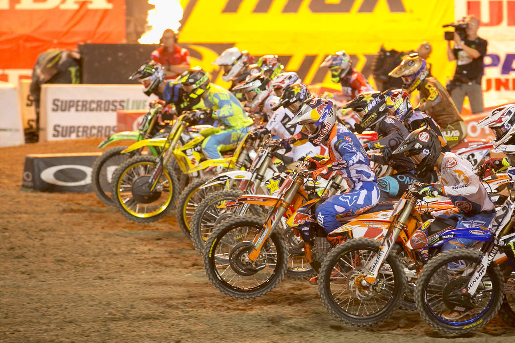 450SX Supercross riders take off at the start of the Monster Energy AMA Supercross 450SX champi ...