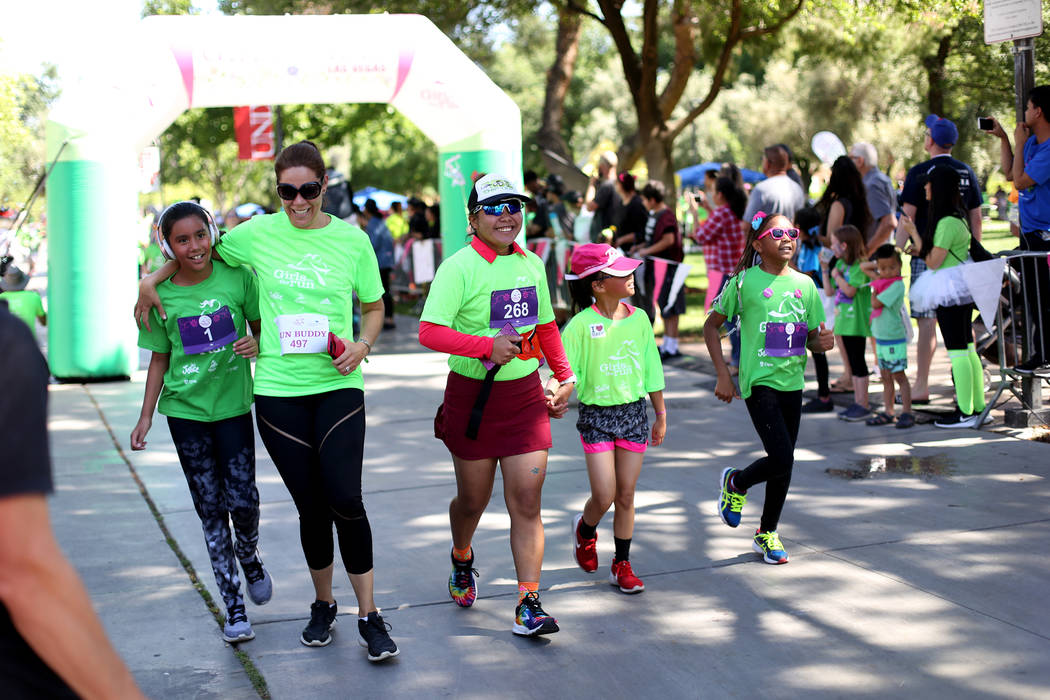 Participants finish the Girls on the Run Las Vegas 5K at UNLV in Las Vegas, Sunday, May 5, 2019 ...