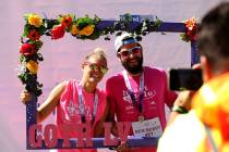 Kendal Sarnecky, left, and James Vega pose for a photo at the Girls on the Run Las Vegas 5K at ...