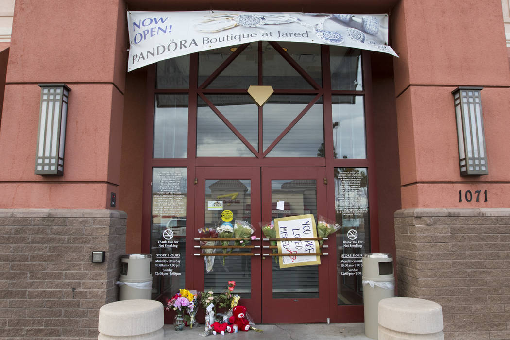 A memorial display in front of Jared, a jewelry store where employee Kimberlee Ann Kincaid-Hill ...