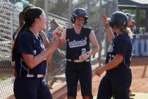 Centennial infielder Ryan Rogers (2) is cheered on by her teammates after scoring a run in the ...