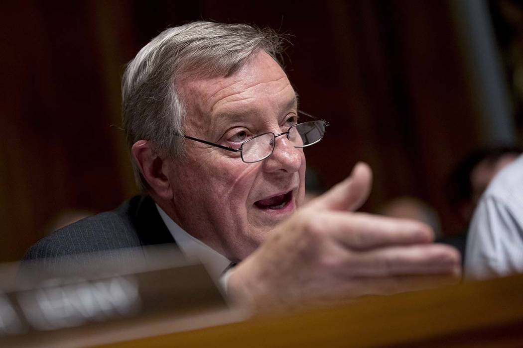 Sen. Richard Durbin, D-Ill., questions Attorney General William Barr as he testifies during a S ...