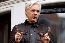 WikiLeaks founder Julian Assange gestures May 19, 2017, to supporters outside the Ecuadorian em ...