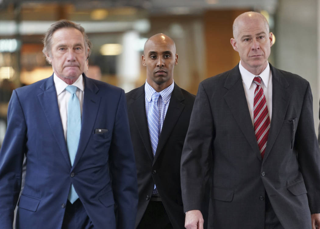 Former Minneapolis police officer Mohamed Noor heads into Hennepin County Government Center in ...