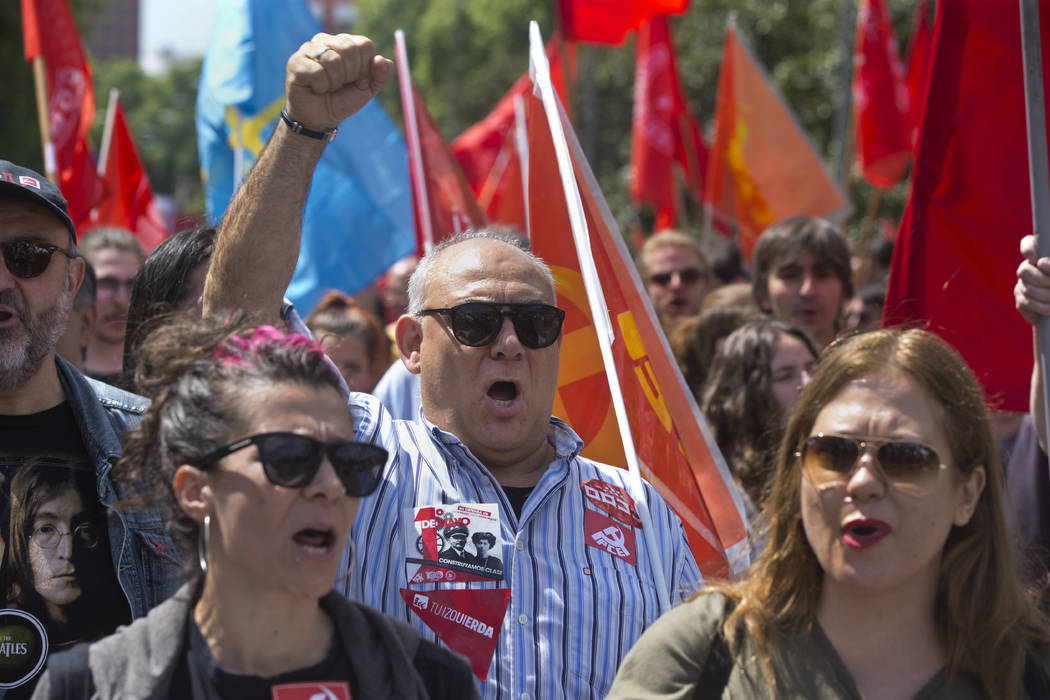 Workers take part in the May Day rally in Madrid, Spain, Wednesday, May 1, 2019. Spain's worker ...