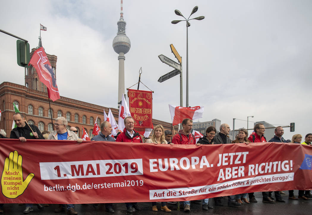 People march in the city center of Berlin, Germany, during a traditional May Day demonstration ...