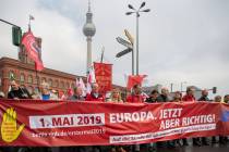 People march in the city center of Berlin, Germany, during a traditional May Day demonstration ...