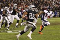 Oakland Raiders running back Doug Martin (28) runs with the football as Denver Broncos inside l ...