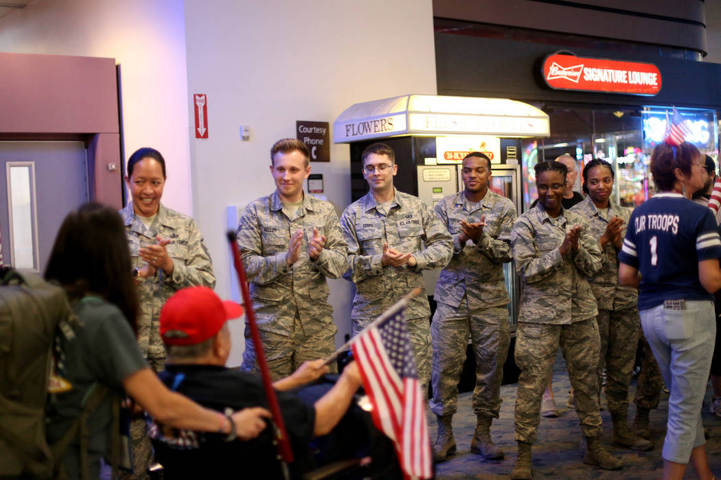 Soldiers welcome back veterans from a trip to visit the national war memorials in Washington D. ...