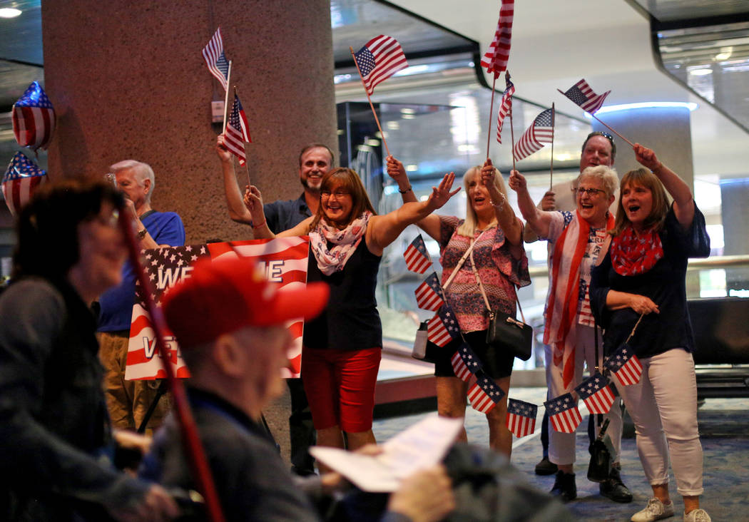 Supporters greet veterans upon their return from a trip to visit the national war memorials in ...