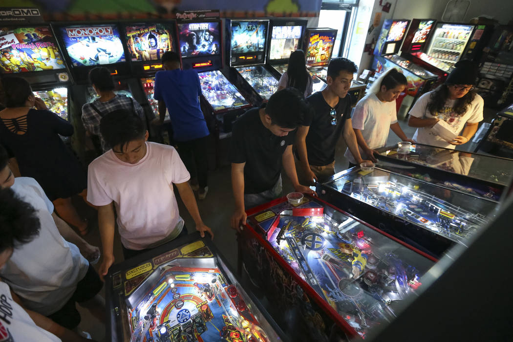 Patrons crowd a row of pinball machines at the Pinball Hall of Fame located at 1610 E. Tropican ...