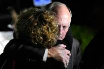 University of North Carolina Charlotte Chancellor Philip DuBois receives a hug after a news con ...