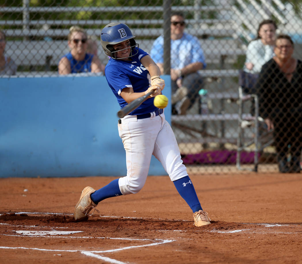 Basic's Mikayla Berg (15) hits a three-run single in the first inning of their Desert Region se ...