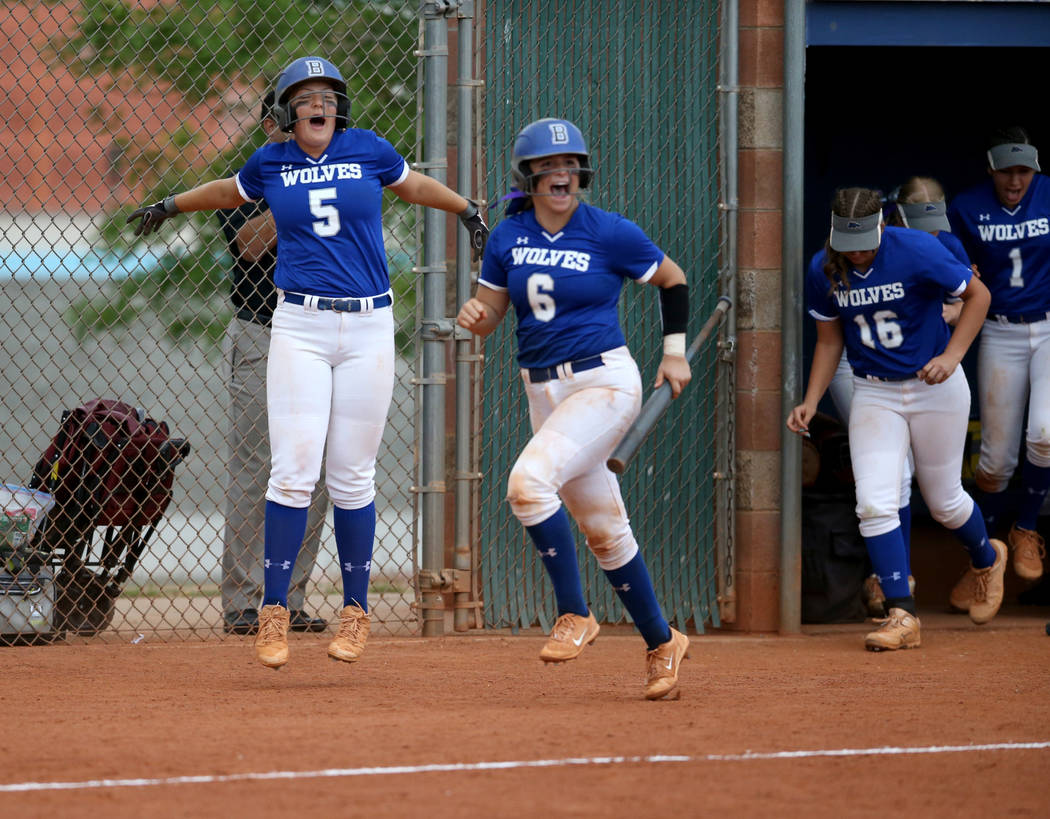 Basic players, including Jordyn Ebert (5) and Angela Santillanes (6) celebrate a home run by Si ...