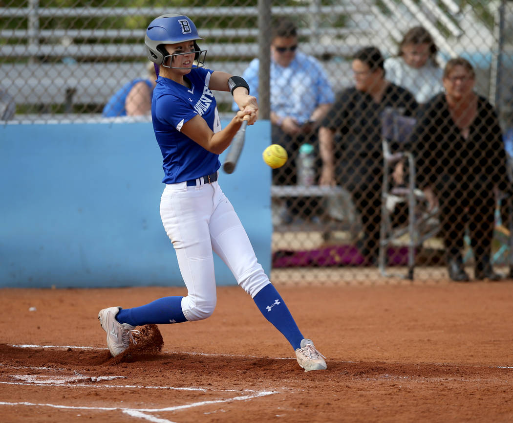 Basic's Lauren Koshak (4) hits in the first inning of a Desert Region semifinal softball game a ...