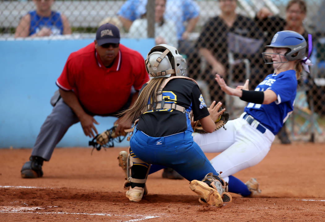 Sierra Vista catcher Aaliyah Medina (16) tags out Basic's Madalyn Bryson (21) in the second inn ...