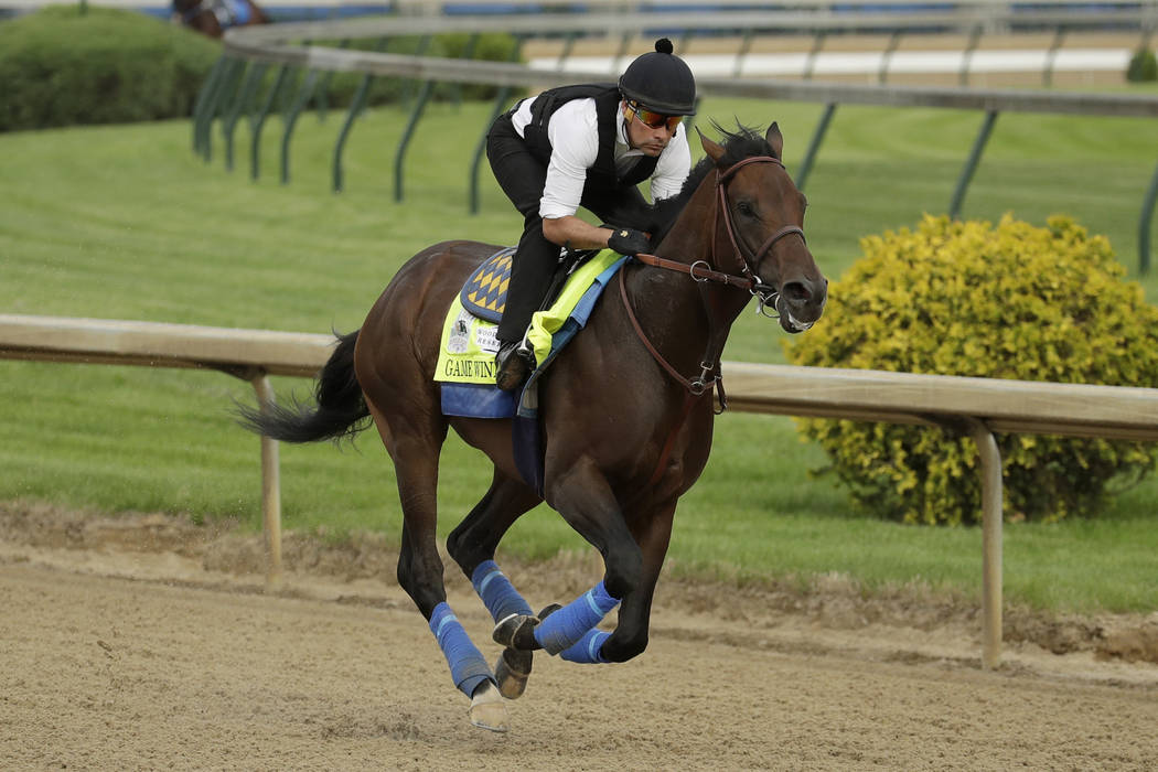 Kentucky Derby entrant Game Winner is ridden during a workout at Churchill Downs Wednesday, May ...