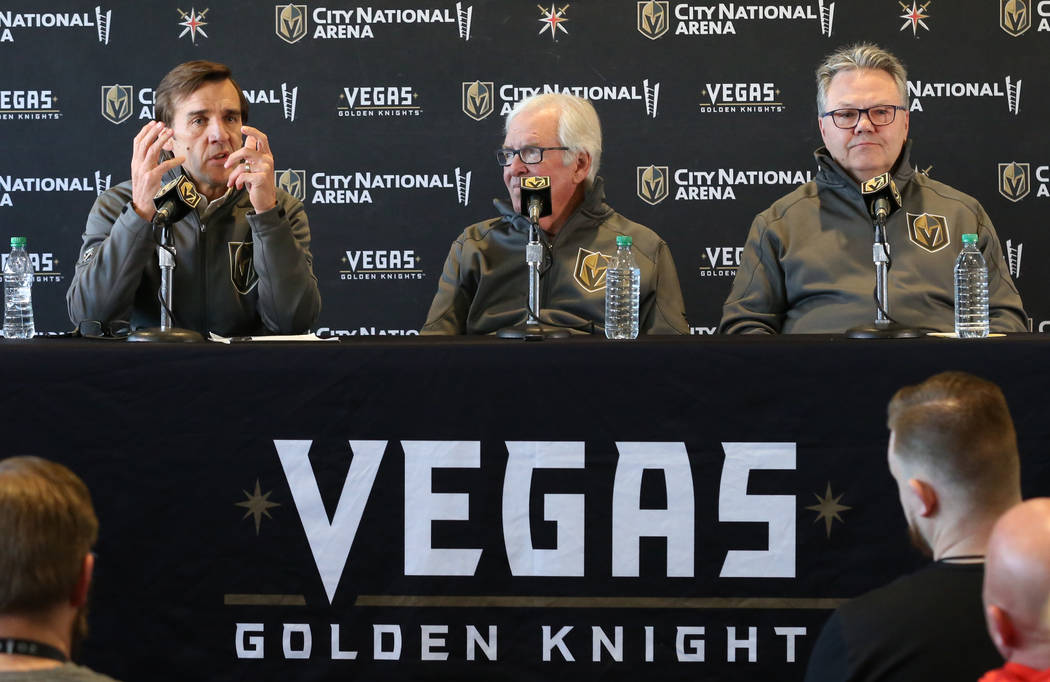 Golden Knights owner Bill Foley, center, and Kelly McCrimmon, the new general manager, right, l ...
