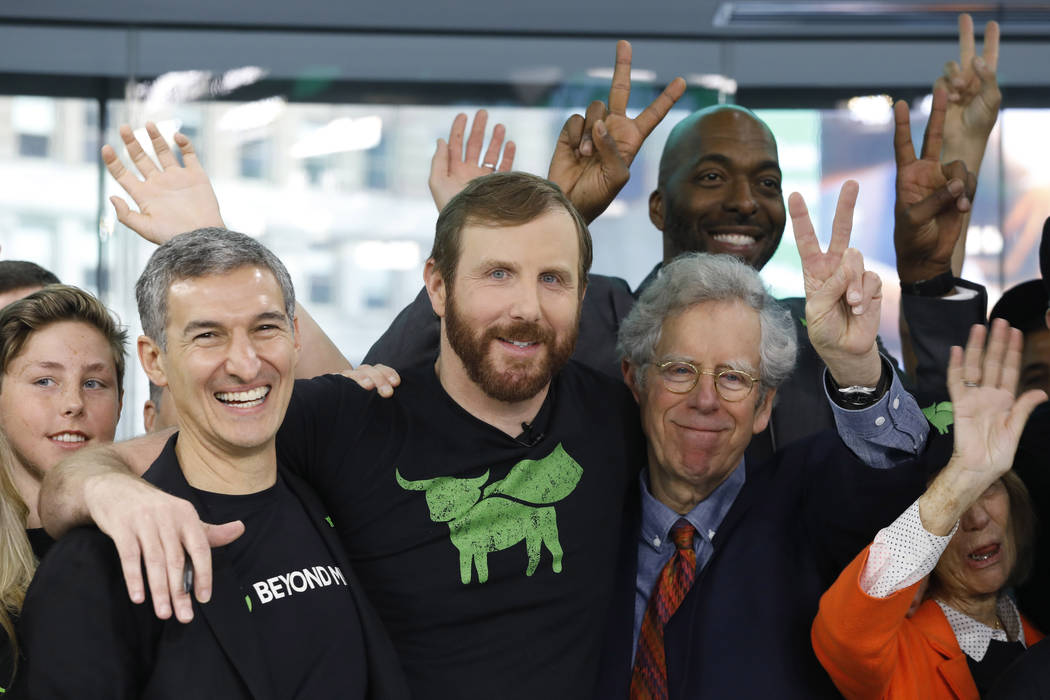 Ethan Brown, center, CEO of Beyond Meat, attends the Opening Bell ceremony to celebrate the com ...