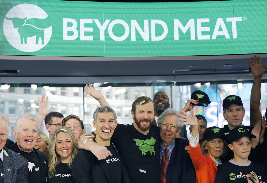 Ethan Brown, center, CEO of Beyond Meat, attends the Opening Bell ceremony with guests to celeb ...