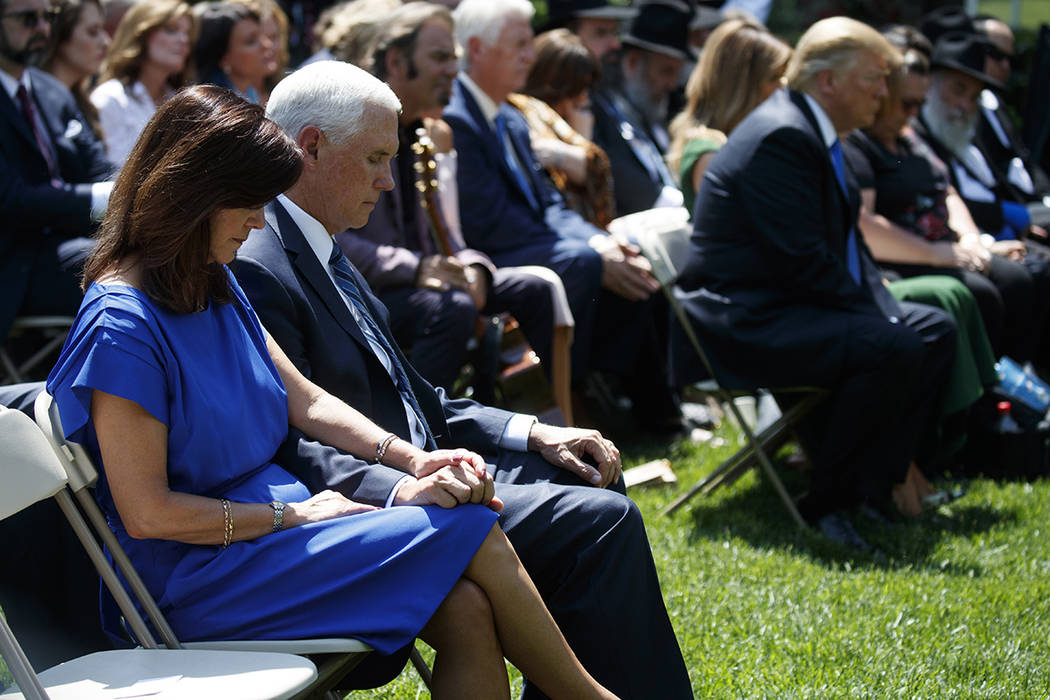 Vice President Mike Pence and Karen Pence pray during a National Day of Prayer event with Presi ...