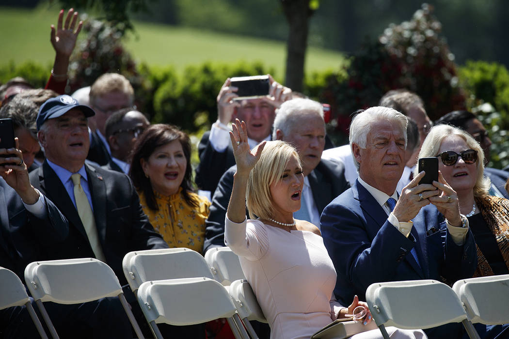 Audience members sing during a National Day of Prayer event with President Donald Trump in the ...