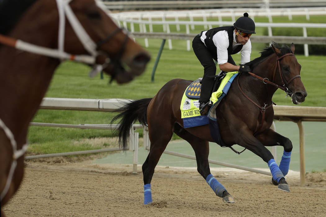 Kentucky Derby entrant Game Winner is ridden during a workout at Churchill Downs Wednesday, May ...
