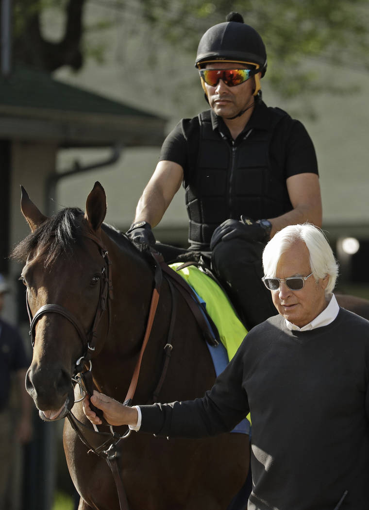 Trainer Bob Baffert leads Kentucky Derby entrant Game Winner to the track for a workout at Chur ...