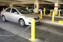 A guest drives through metal and concrete barriers as he leaves the Wynn Las Vegas parking gara ...