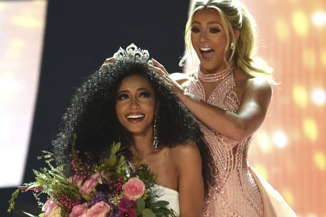 Miss North Carolina Cheslie Kryst gets crowned by last year's winner Sarah Rose Summers after w ...