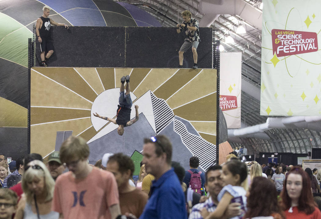 Performers with Off Axis Acrobatics leap on a trampwall during the Las Vegas Science & Tech ...
