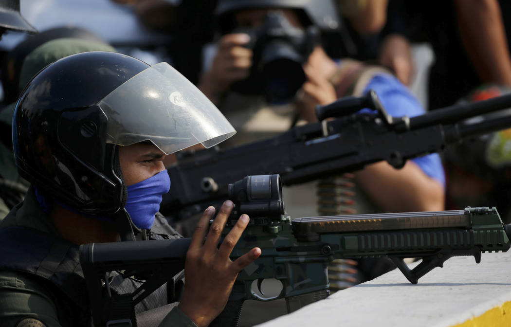 Armed, rebel soldiers who are rising up against the government of Venezuela's President Nicolas ...