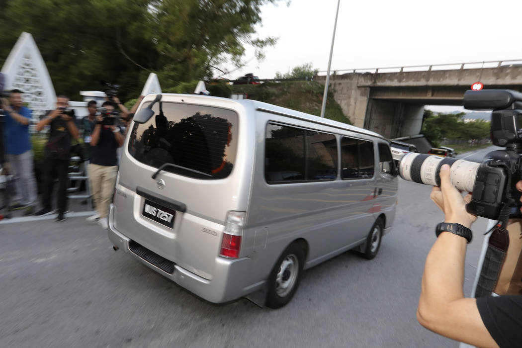 A car, which is believed to be carrying Vietnamese Doan Thi Huong, leaves a prison in Kajang, M ...