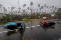 Motorcycles lie on a street in Puri district after Cyclone Fani hit the coastal eastern state o ...