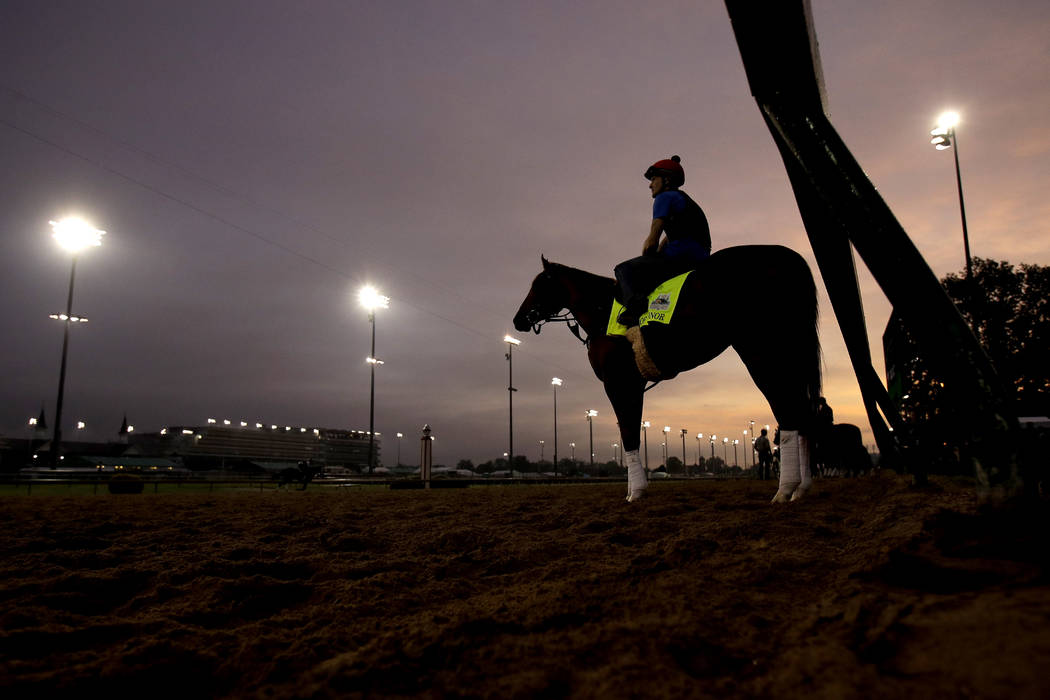 Kentucky Derby entrant Code of Honor waits on the track to workout at Churchill Downs Thursday, ...