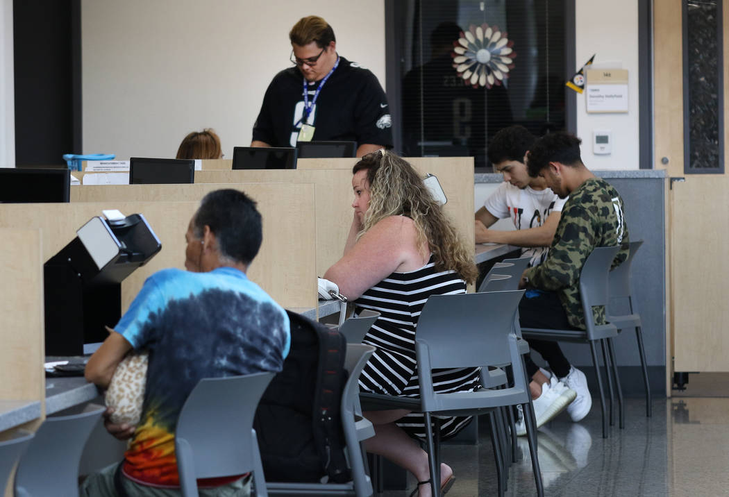 Customers are helped by DMV service technicians at Sahara DMV office on Friday, May 10, 2019, i ...
