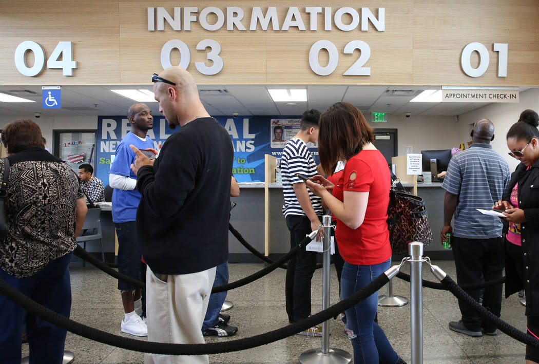 Customers wait in line the DMV at the East Sahara office on Friday, May 10, 2019, in Las Vegas. ...