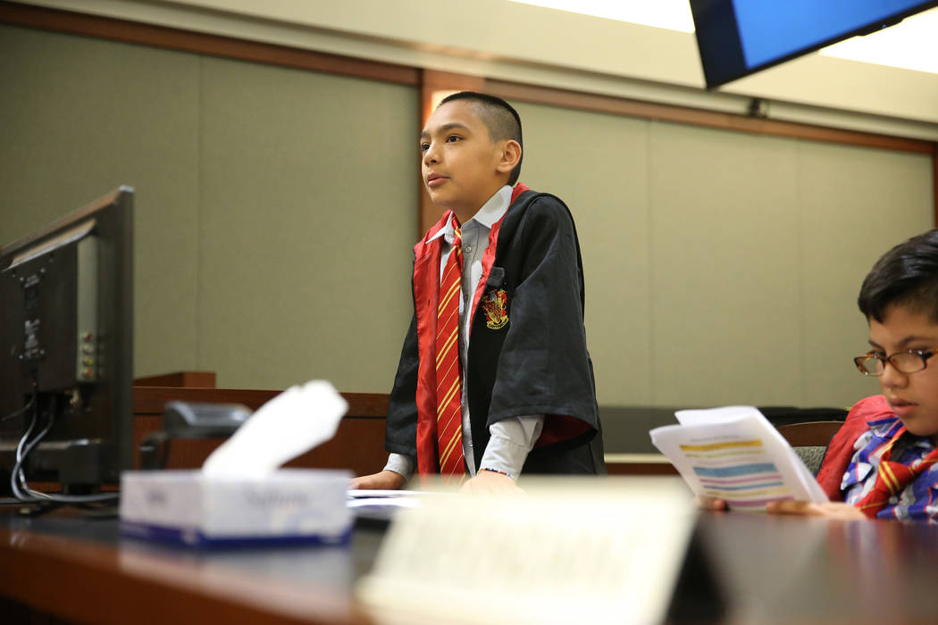 Playing as an attorney Jaivian Gonzalez, 10, speaks during a mock trial at the Regional Justice ...