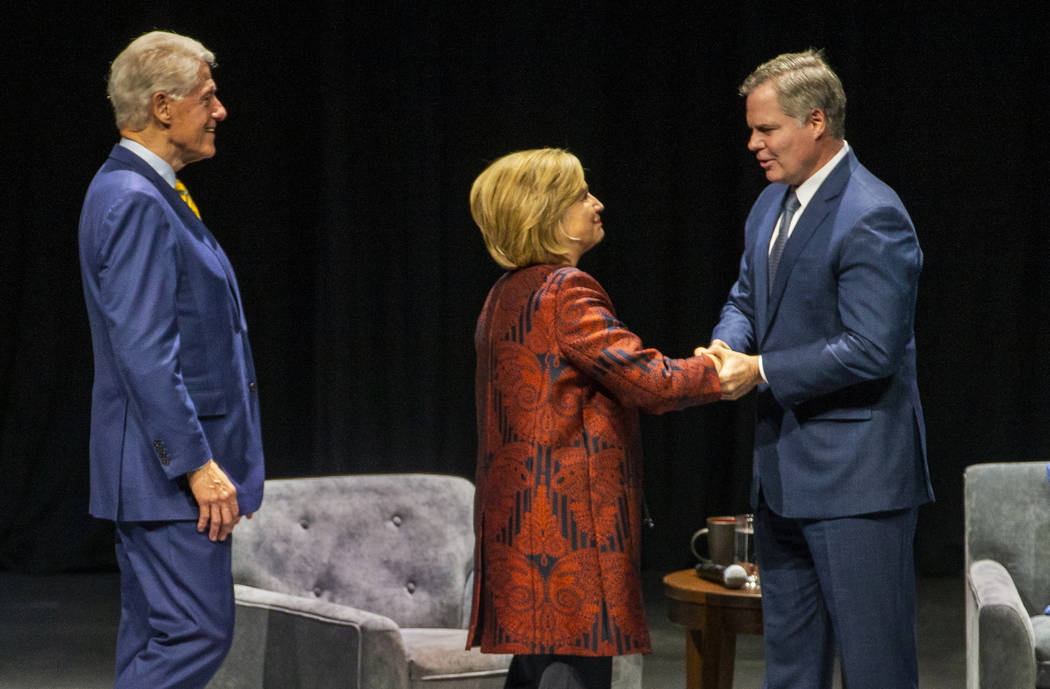 Former U.S. President Bill Clinton and former U.S. Secretary of State Hillary Clinton greet Jim ...