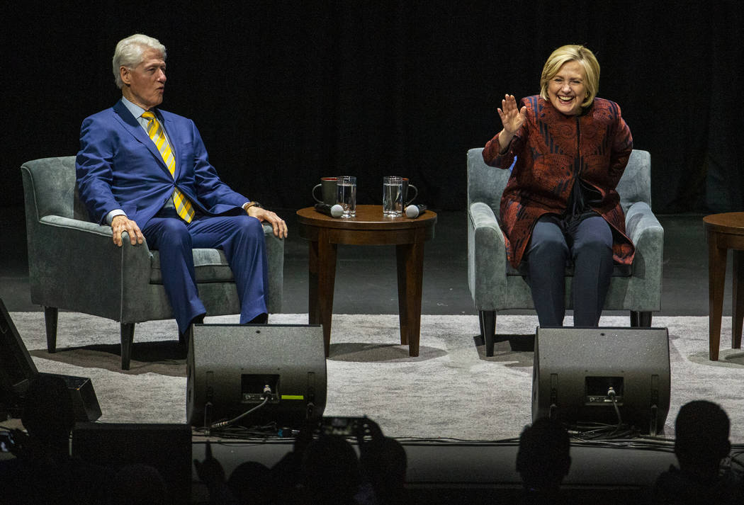 Former U.S. President Bill Clinton and former U.S. Secretary of State Hillary Clinton greet the ...