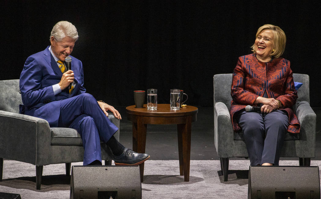 Former U.S. President Bill Clinton and U.S. Secretary of State Hillary Clinton share a laugh du ...