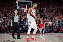 Portland Trail Blazers guard Rodney Hood reacts after making a three point basket against the D ...