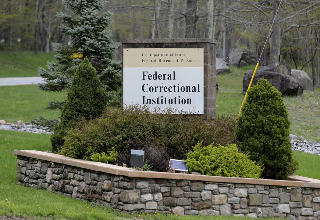 In this May 1, 2019 photo, a sign marks the entrance to the Federal Correctional Institution, O ...