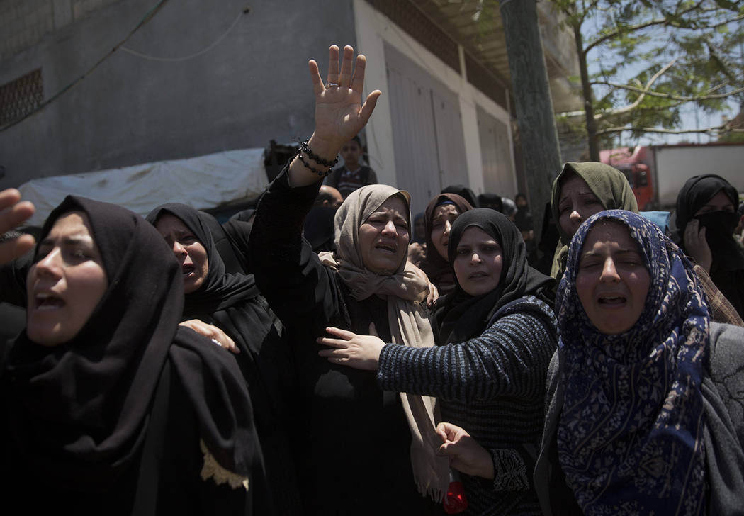 Relatives mourn Palestinian Raid Abu Tair, who was killed by Israeli troops during Friday's pro ...