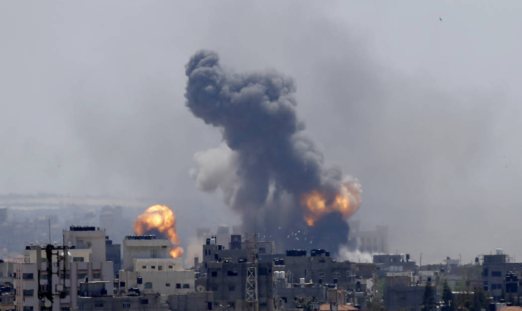 Smoke rises from an explosion caused by an Israeli airstrike in Gaza City, Saturday, May 4, 201 ...