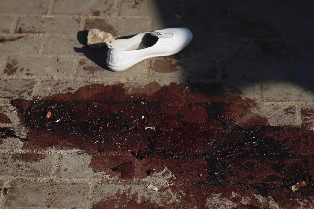 Blood stains and a shoe of a woman that was injured after a rocket fired from Gaza Strip hit in ...