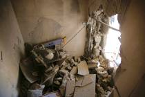 A damage to a house is seen after a rocket fired from Gaza Strip hit in the southern Israeli ci ...