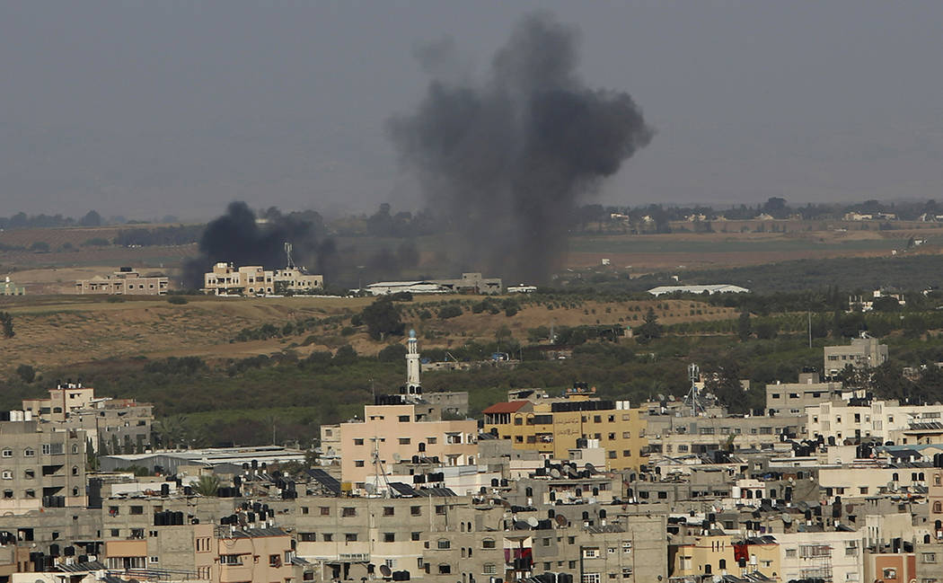 An explosion caused by Israeli airstrikes is seen in Gaza City, Saturday, May 4, 2019. Palestin ...