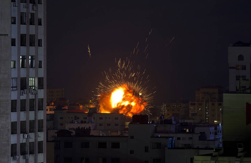 An explosion caused by an Israeli airstrike on a building in Gaza City, Saturday, May 4, 2019. ...