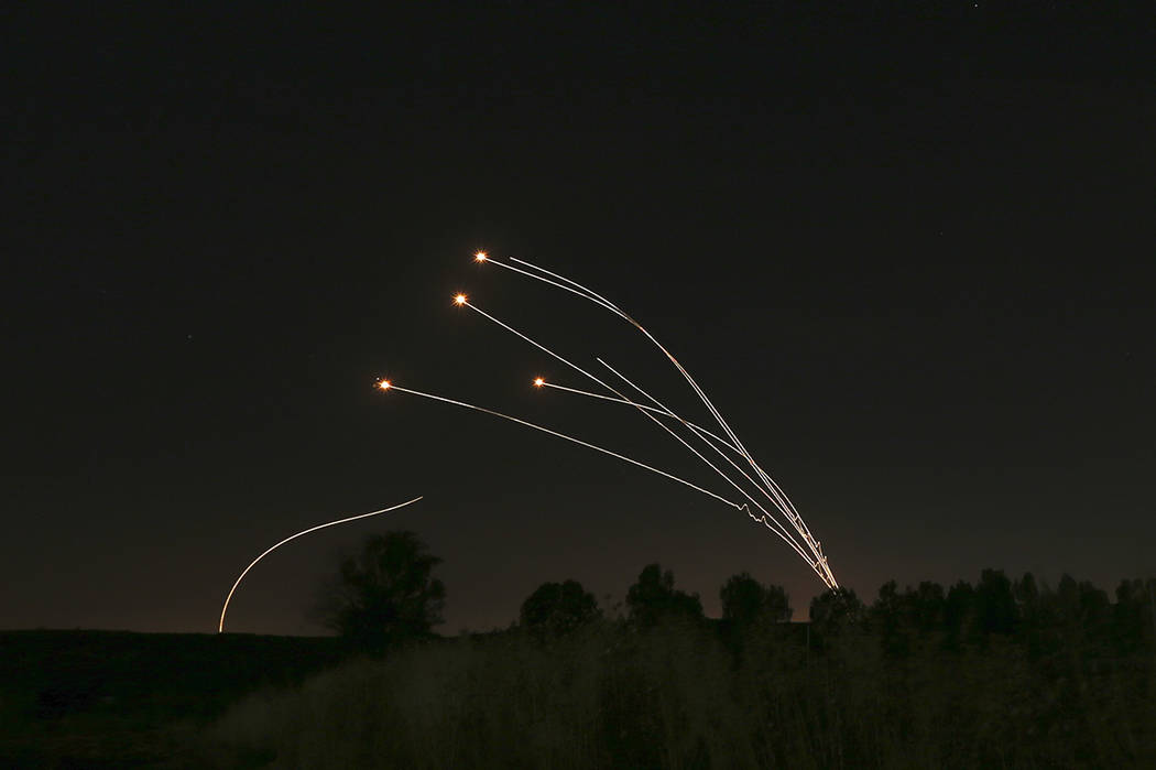 Israeli air defense system Iron Dome takes out rockets fired from Gaza near Sderot, Israel, Sat ...
